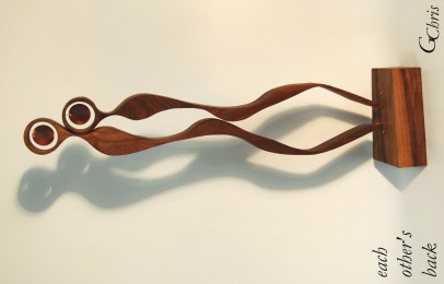 Celebrates the power, comfort and connection between people who stand at and cover each other's back.